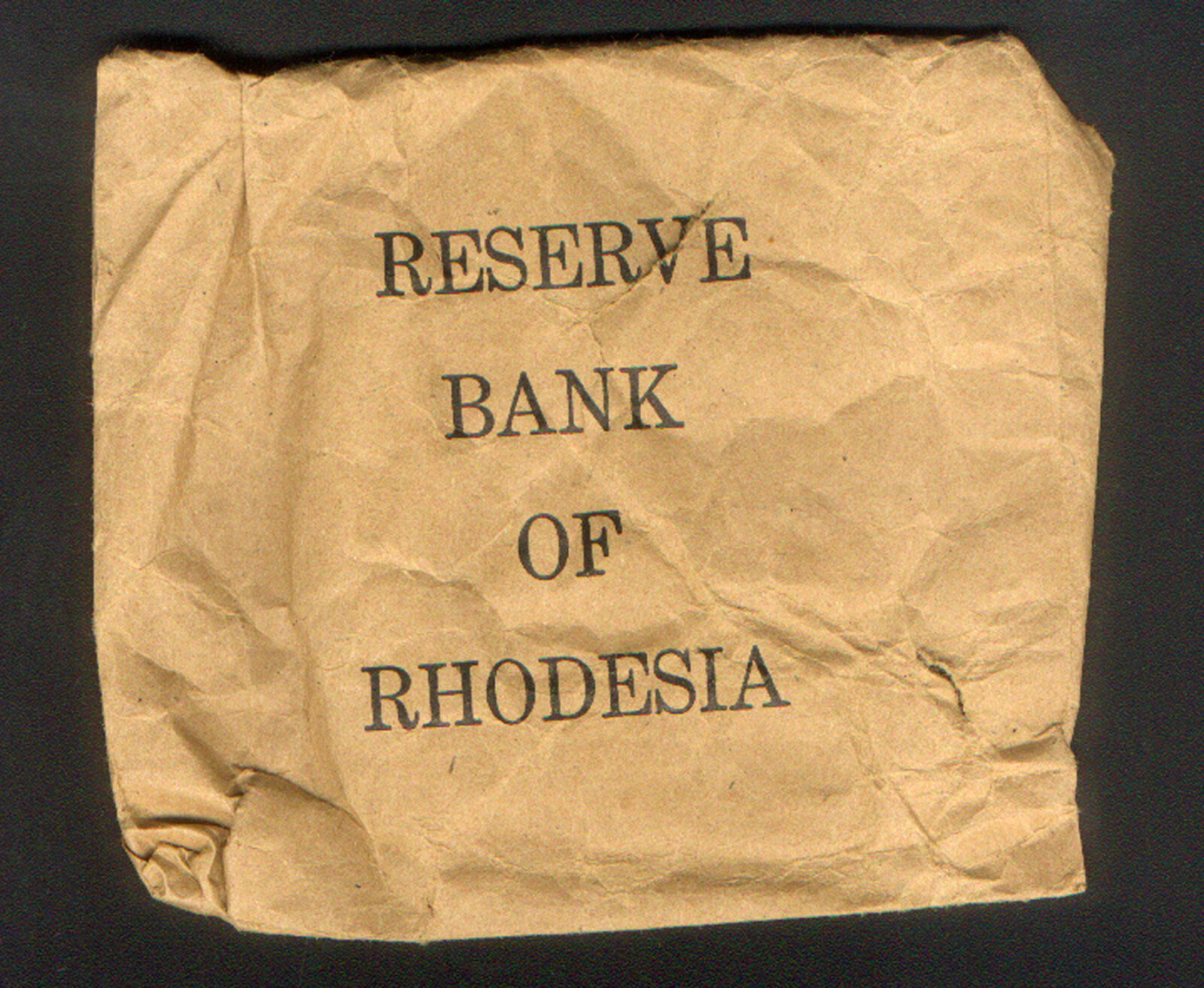RHODESIA ( now ZIMBABWE ) EMPTY PAPER COIN BAG from LAST ISSUE of 1/2 CENT USED